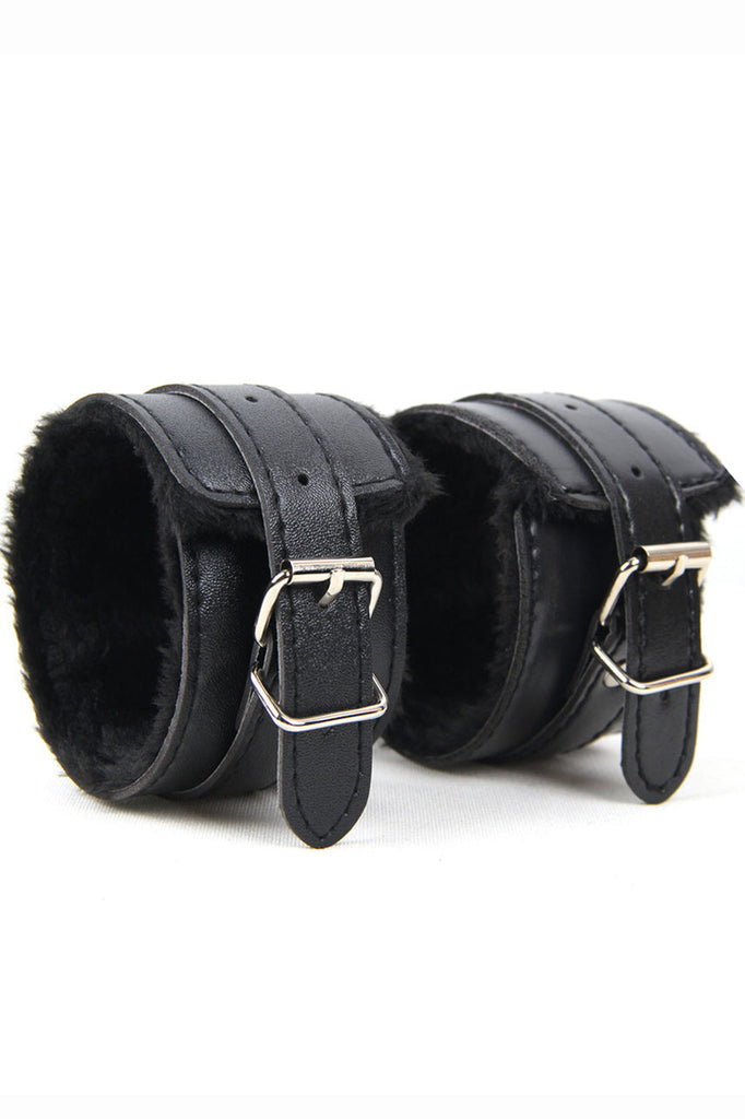 Shop these faux black leather wrist cuffs for your dominatrix outfit