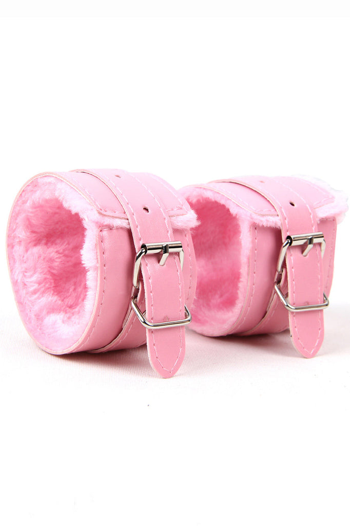 Shop these faux pink leather wrist cuffs with adjustable buckles
