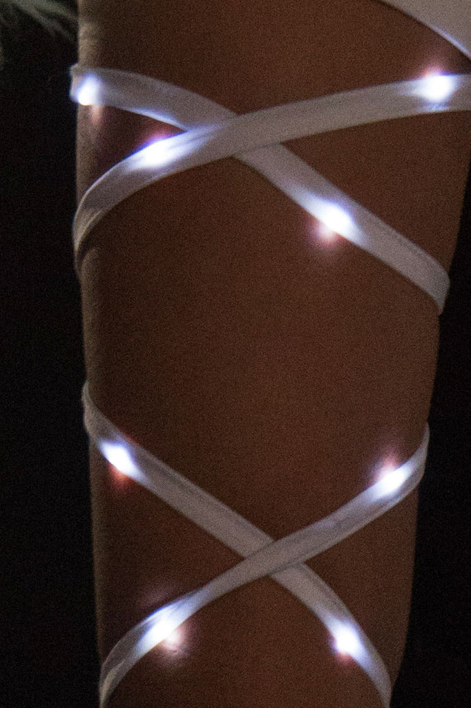 Shop this women's close up of white led leg wraps by J Valentine