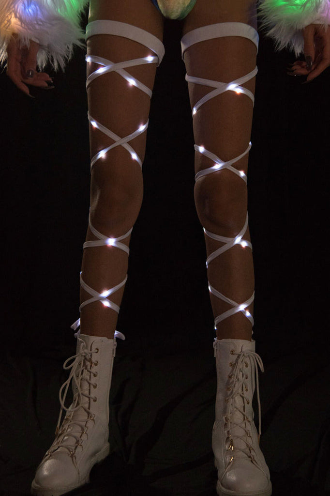 Women's white and white led lights woven into white leg wraps.  Product by J. Valentine.