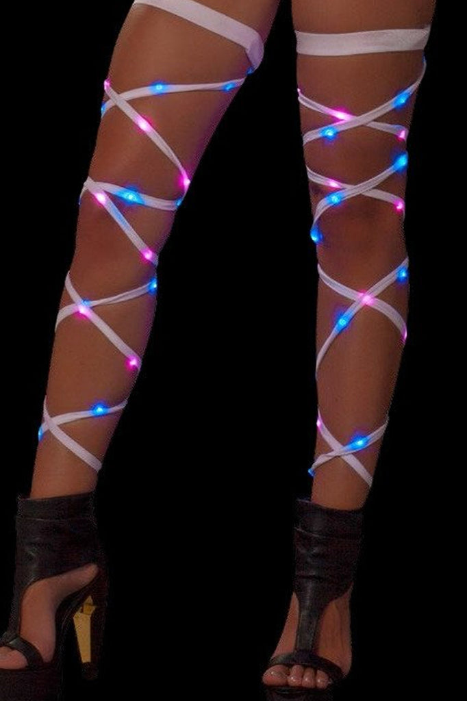 Women's pink and blue LED lights woven into white leg wraps.  J. Valentine product.